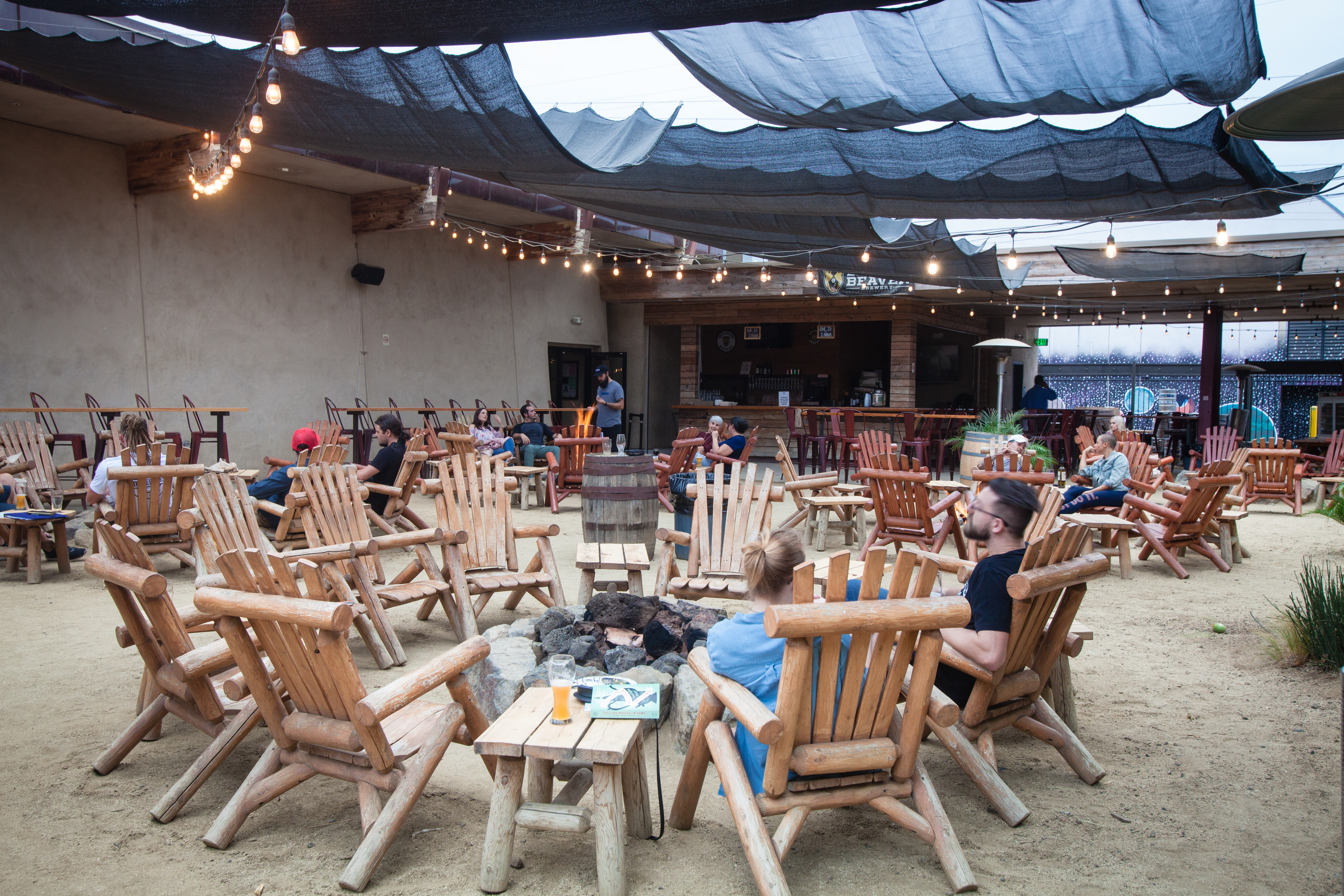 Adirondacks around a fire at Belching Beaver in Vista, California.